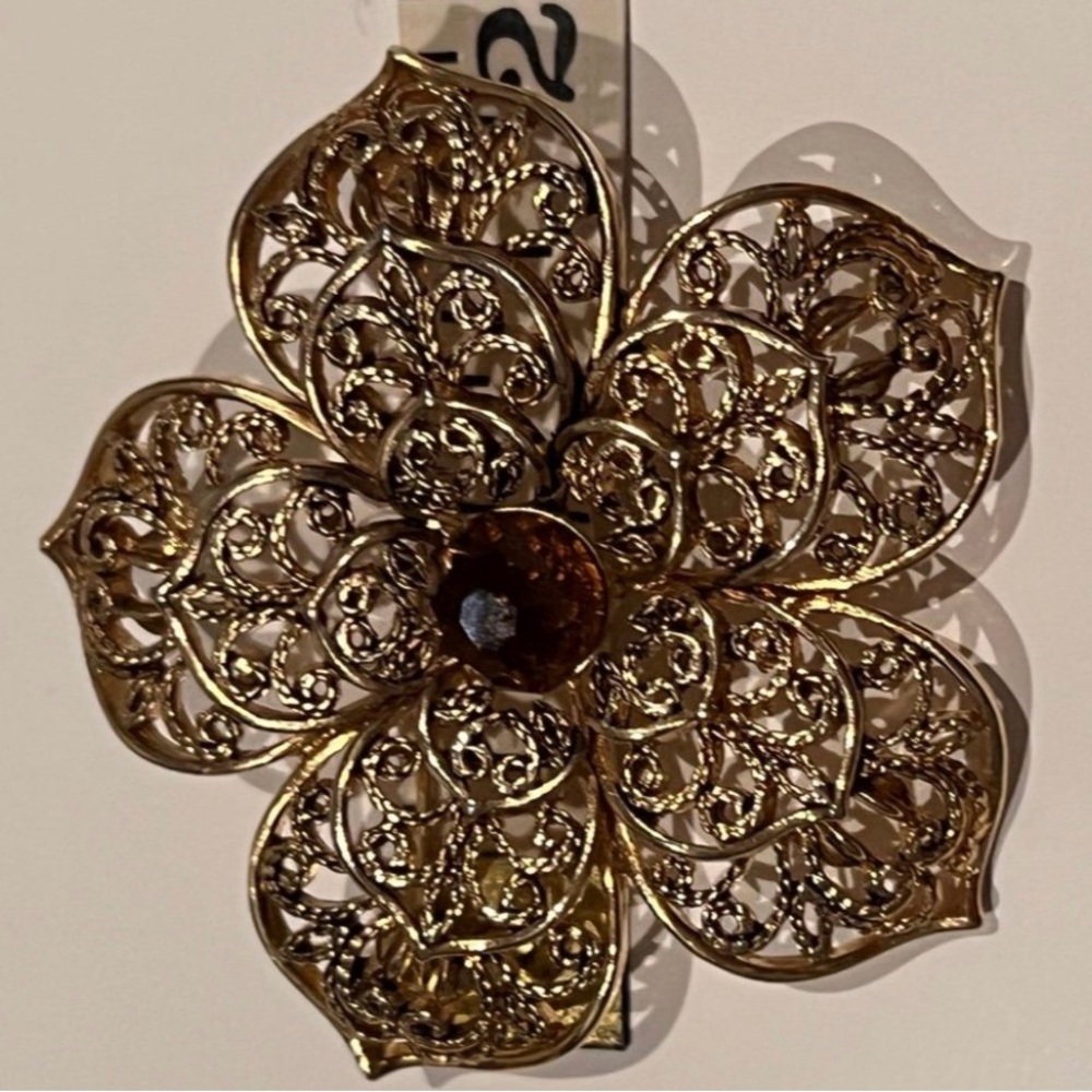 Vintage brooch Monet goldtone filigree flower with a amber brown center bead